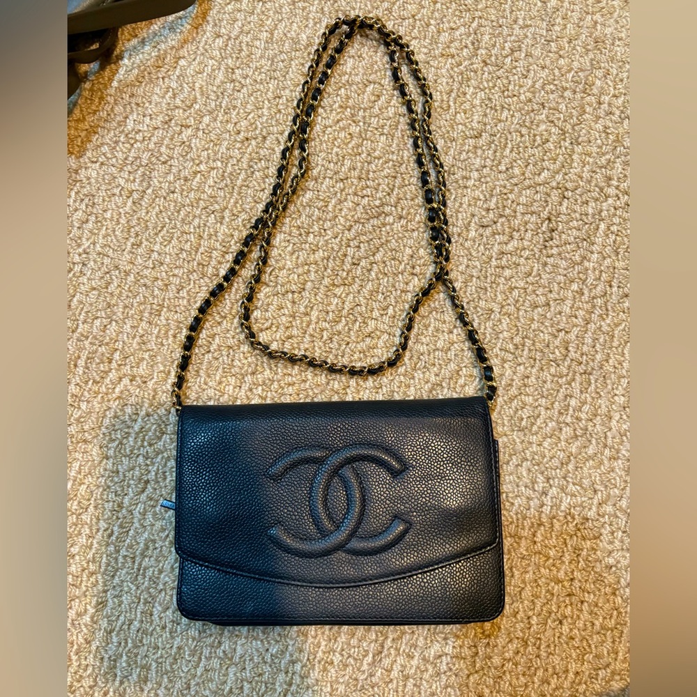 Chanel black leather wallet on a chain in excellent condition